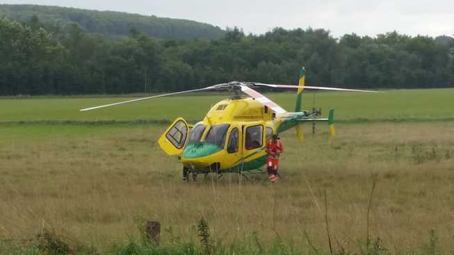 Wiltshire Air Ambulance parked in the field outside our house. Upavon. Sept 2015